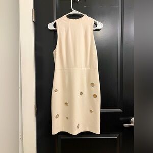 Mini dress with metal cutouts, hardly worn